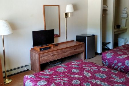 Wigwam Motel room with tv and fridge